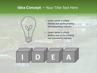 A Group Of Boats Floating On Top Of A River PowerPoint Template