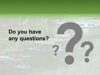 A Group Of Boats Floating On Top Of A River PowerPoint Template