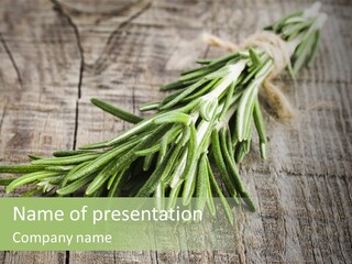 A Bunch Of Rosemary On A Wooden Table PowerPoint Template