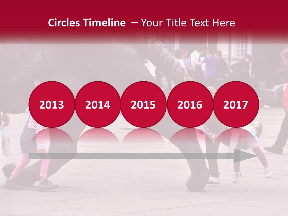 A Group Of Children Playing In Front Of A Statue PowerPoint Template