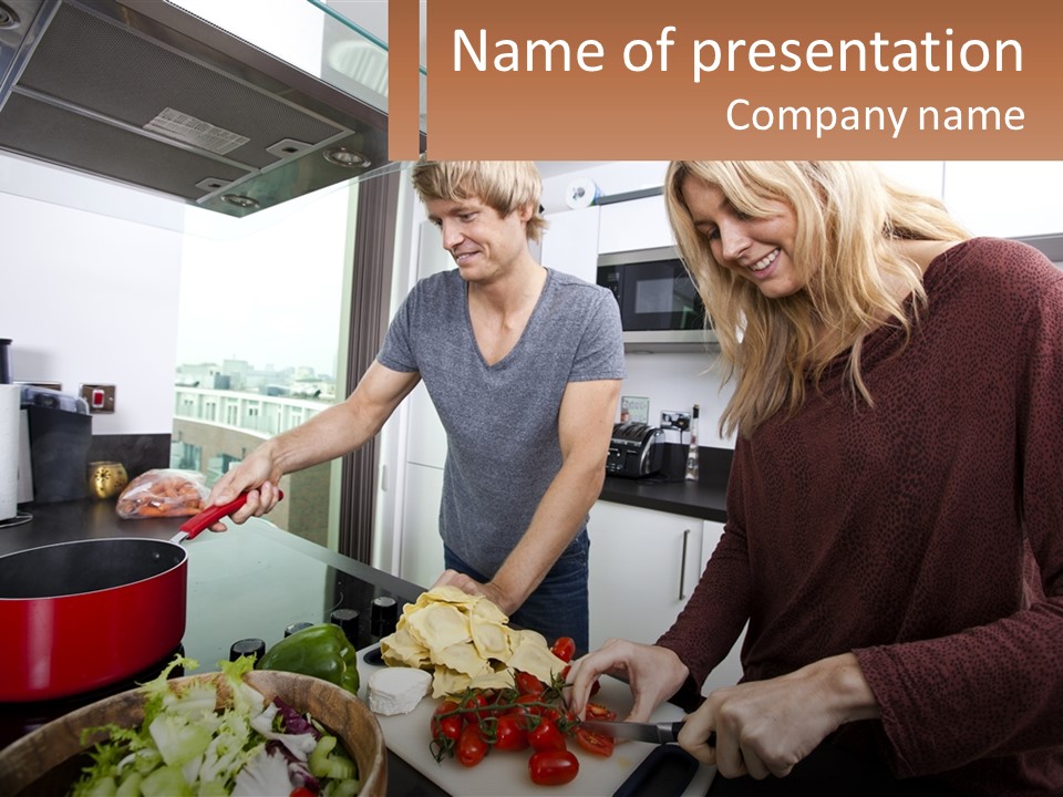 A Couple Of People In A Kitchen Preparing Food PowerPoint Template