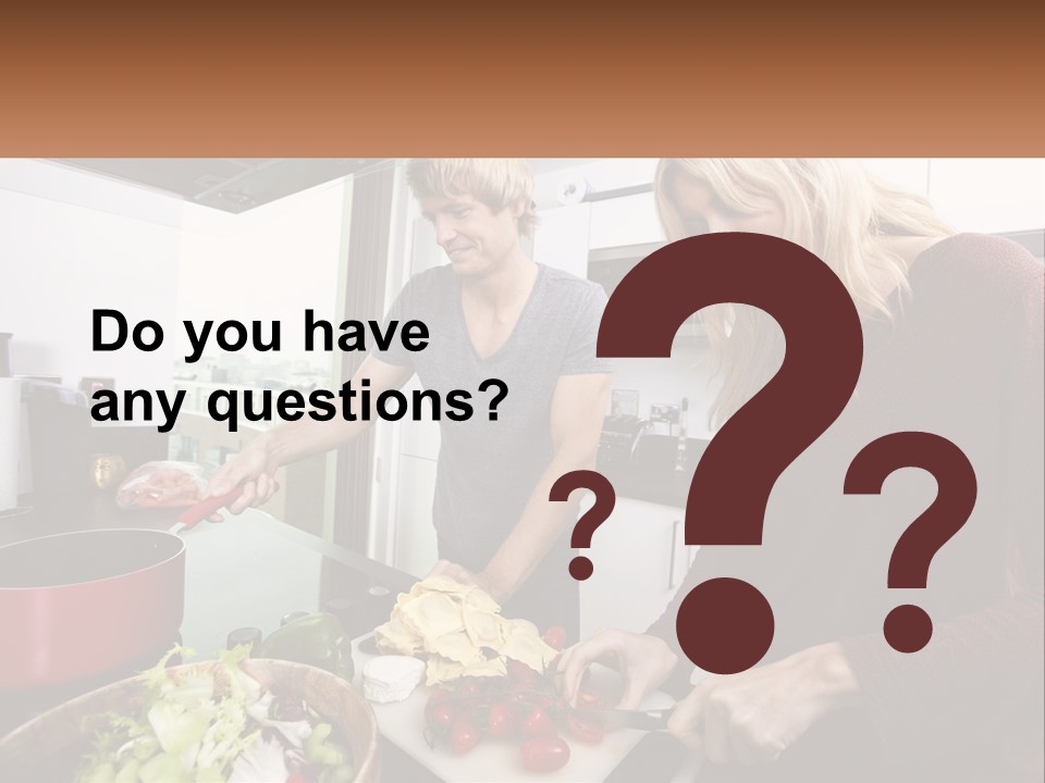 A Couple Of People In A Kitchen Preparing Food PowerPoint Template