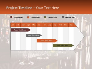A Row Of Cocktail Glasses Sitting On Top Of A Bar PowerPoint Template