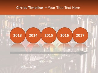 A Row Of Cocktail Glasses Sitting On Top Of A Bar PowerPoint Template