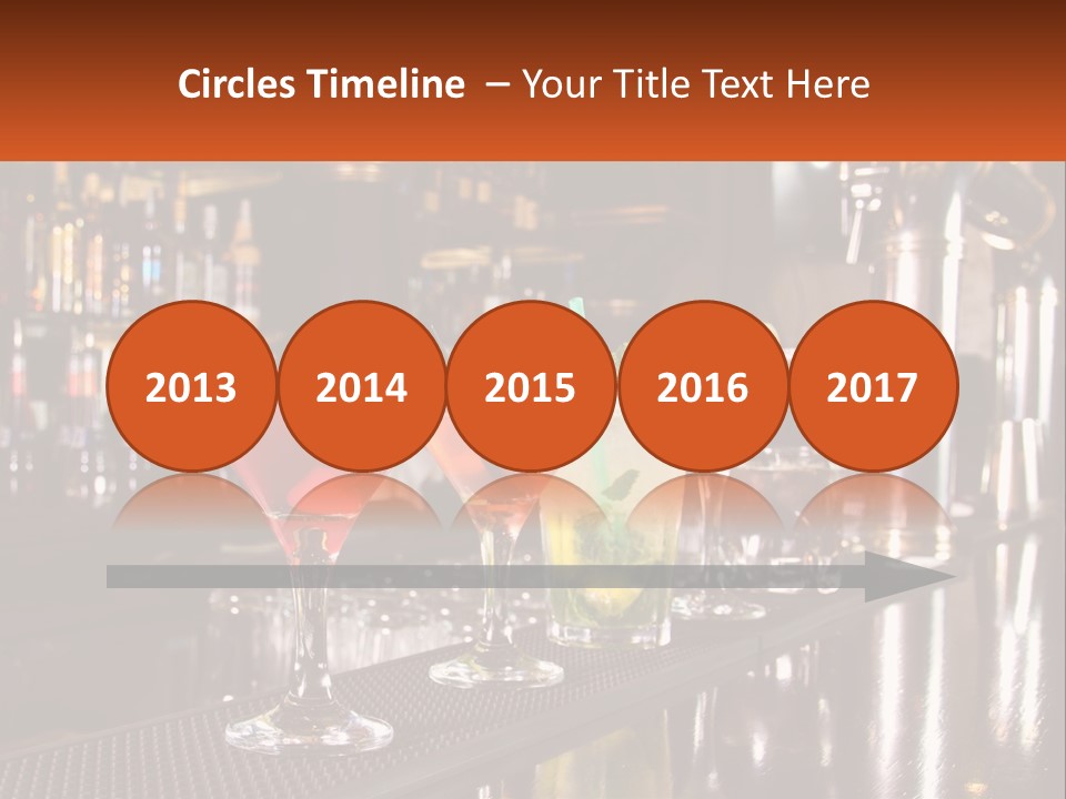 A Row Of Cocktail Glasses Sitting On Top Of A Bar PowerPoint Template