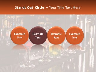 A Row Of Cocktail Glasses Sitting On Top Of A Bar PowerPoint Template