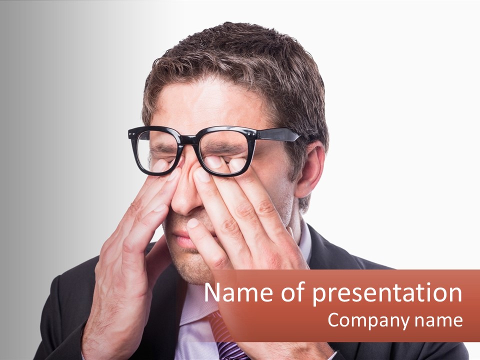 A Man Wearing Glasses Covering His Eyes With His Hands PowerPoint Template