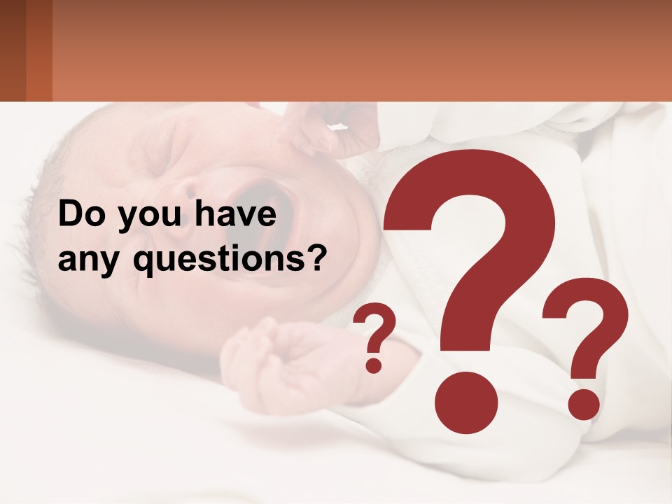 A Baby Yawning While Laying On A Bed PowerPoint Template