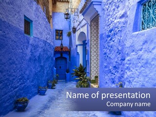 A Narrow Alley With Blue Walls And Potted Plants PowerPoint Template