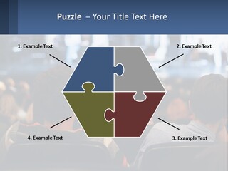 A Group Of People Sitting In Front Of A Stage PowerPoint Template