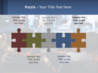 A Group Of People Sitting In Front Of A Stage PowerPoint Template