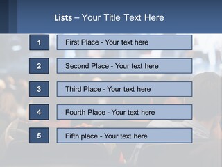 A Group Of People Sitting In Front Of A Stage PowerPoint Template