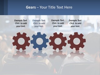 A Group Of People Sitting In Front Of A Stage PowerPoint Template