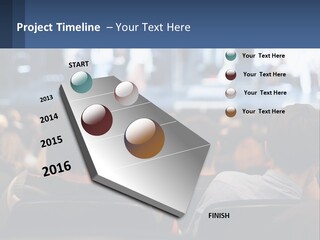 A Group Of People Sitting In Front Of A Stage PowerPoint Template