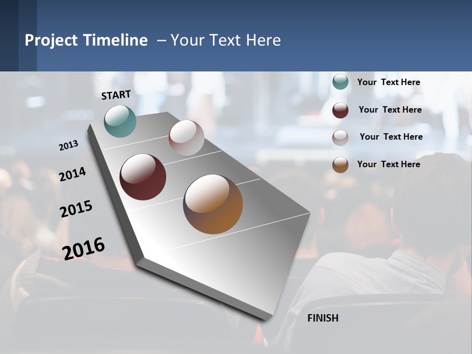 A Group Of People Sitting In Front Of A Stage PowerPoint Template