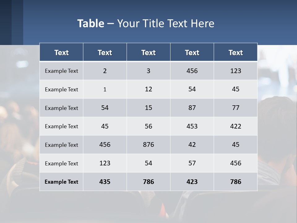 A Group Of People Sitting In Front Of A Stage PowerPoint Template