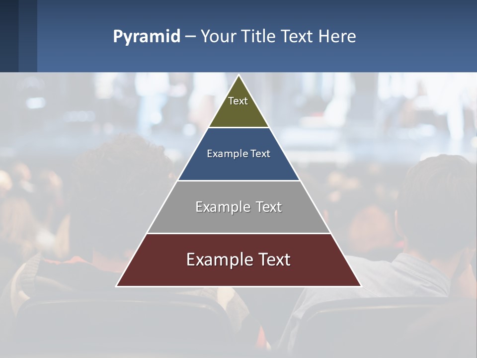 A Group Of People Sitting In Front Of A Stage PowerPoint Template
