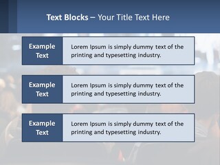 A Group Of People Sitting In Front Of A Stage PowerPoint Template