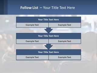 A Group Of People Sitting In Front Of A Stage PowerPoint Template