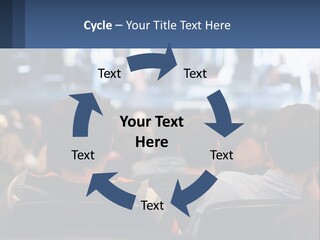 A Group Of People Sitting In Front Of A Stage PowerPoint Template