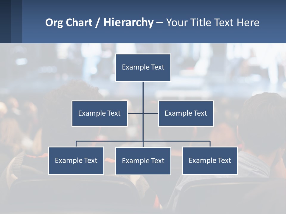 A Group Of People Sitting In Front Of A Stage PowerPoint Template