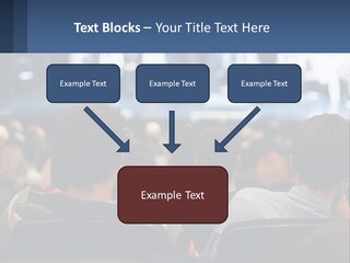 A Group Of People Sitting In Front Of A Stage PowerPoint Template