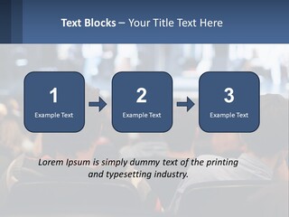 A Group Of People Sitting In Front Of A Stage PowerPoint Template