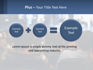 A Group Of People Sitting In Front Of A Stage PowerPoint Template