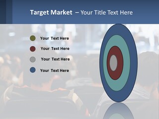 A Group Of People Sitting In Front Of A Stage PowerPoint Template