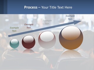 A Group Of People Sitting In Front Of A Stage PowerPoint Template