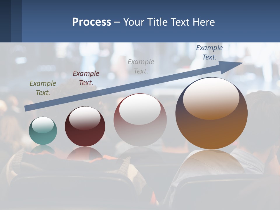 A Group Of People Sitting In Front Of A Stage PowerPoint Template