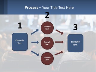 A Group Of People Sitting In Front Of A Stage PowerPoint Template