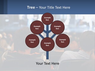 A Group Of People Sitting In Front Of A Stage PowerPoint Template