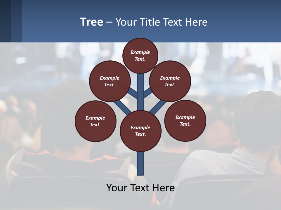 A Group Of People Sitting In Front Of A Stage PowerPoint Template