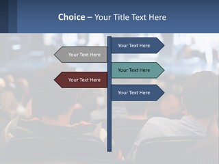 A Group Of People Sitting In Front Of A Stage PowerPoint Template
