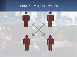 A Group Of People Sitting In Front Of A Stage PowerPoint Template