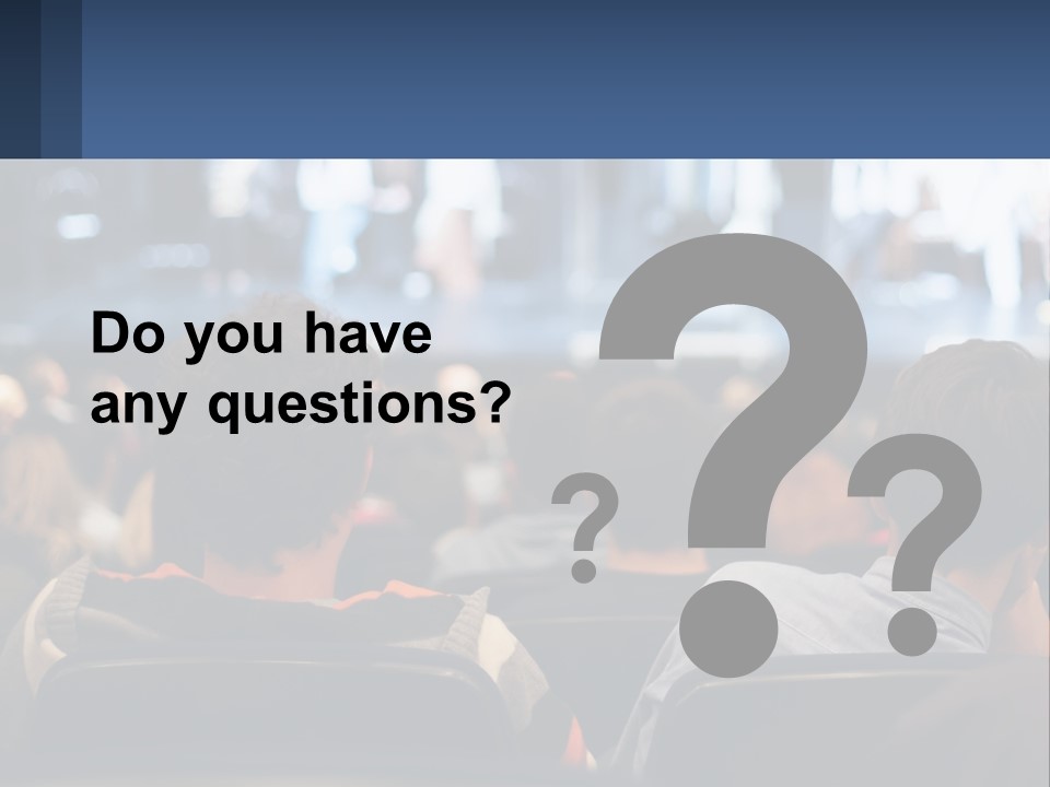 A Group Of People Sitting In Front Of A Stage PowerPoint Template