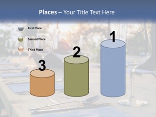 A Table Topped With Wine Glasses And Place Settings PowerPoint Template