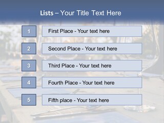 A Table Topped With Wine Glasses And Place Settings PowerPoint Template