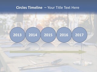 A Table Topped With Wine Glasses And Place Settings PowerPoint Template