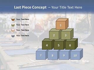 A Table Topped With Wine Glasses And Place Settings PowerPoint Template