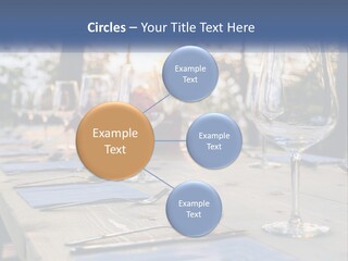A Table Topped With Wine Glasses And Place Settings PowerPoint Template