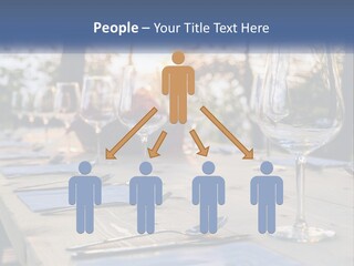 A Table Topped With Wine Glasses And Place Settings PowerPoint Template