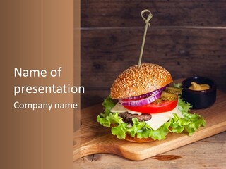 A Hamburger With Lettuce, Tomato, Onion And Cheese On A Cutting Board PowerPoint Template