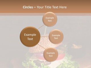 A Hamburger With Lettuce, Tomato, Onion And Cheese On A Cutting Board PowerPoint Template