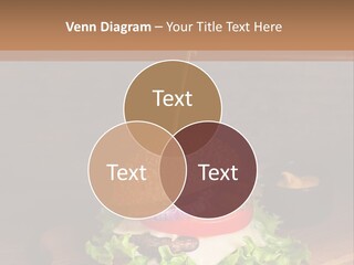 A Hamburger With Lettuce, Tomato, Onion And Cheese On A Cutting Board PowerPoint Template