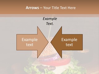 A Hamburger With Lettuce, Tomato, Onion And Cheese On A Cutting Board PowerPoint Template