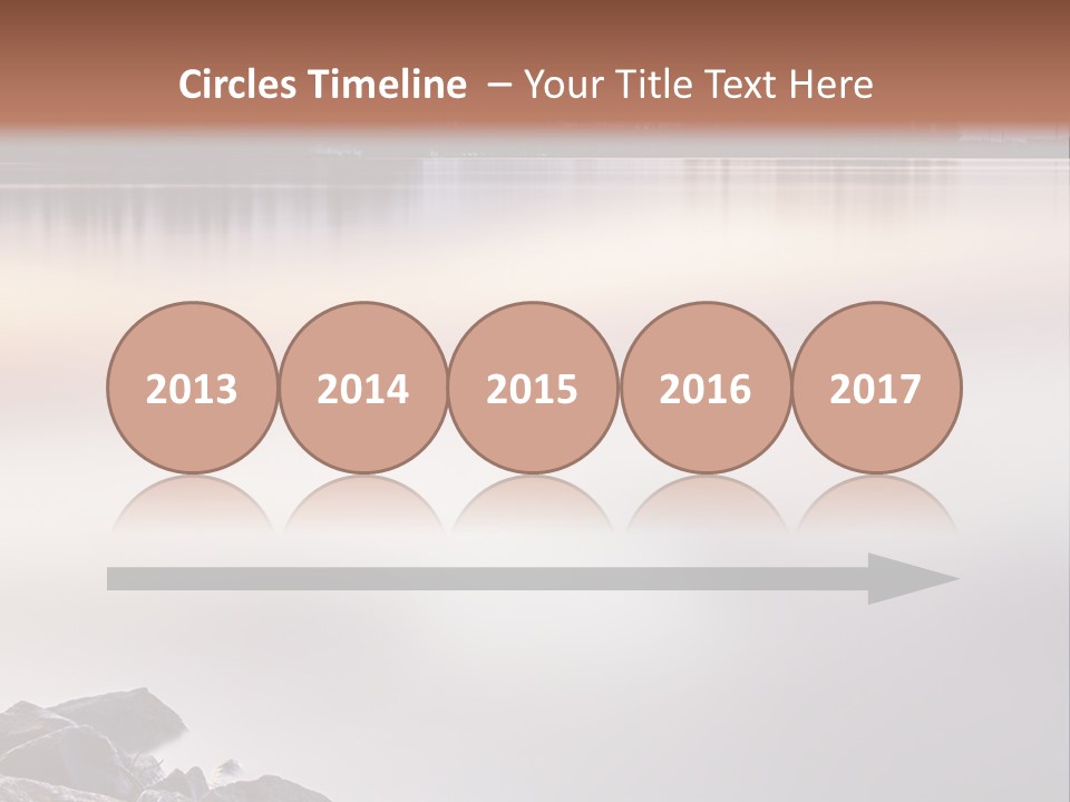 A Large Body Of Water Surrounded By Rocks PowerPoint Template