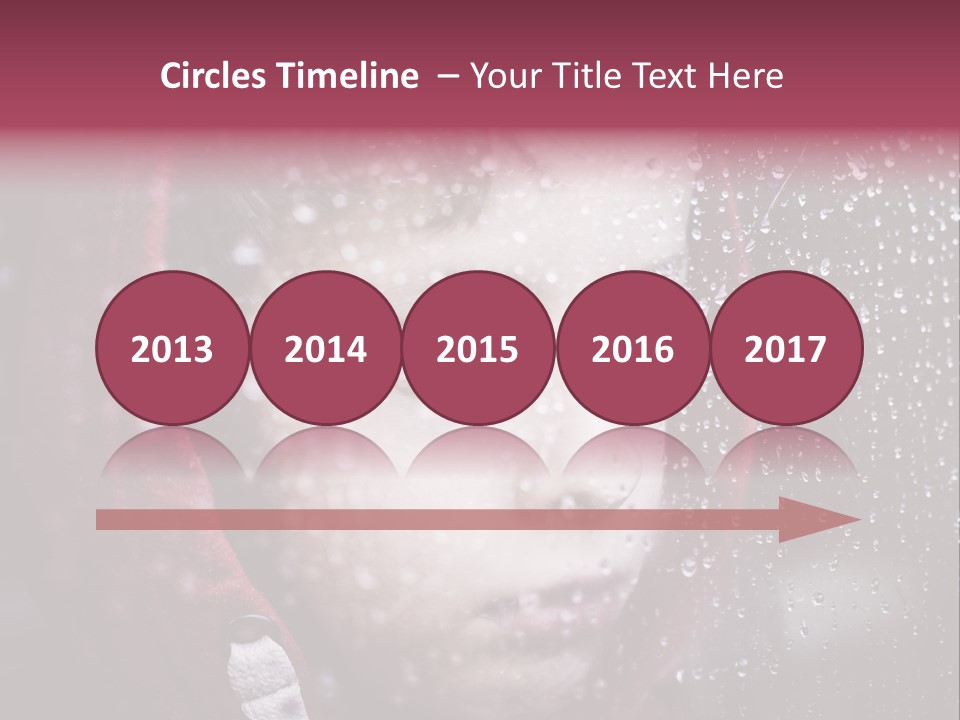 A Young Boy Looking Out Of A Window Covered In Snow PowerPoint Template