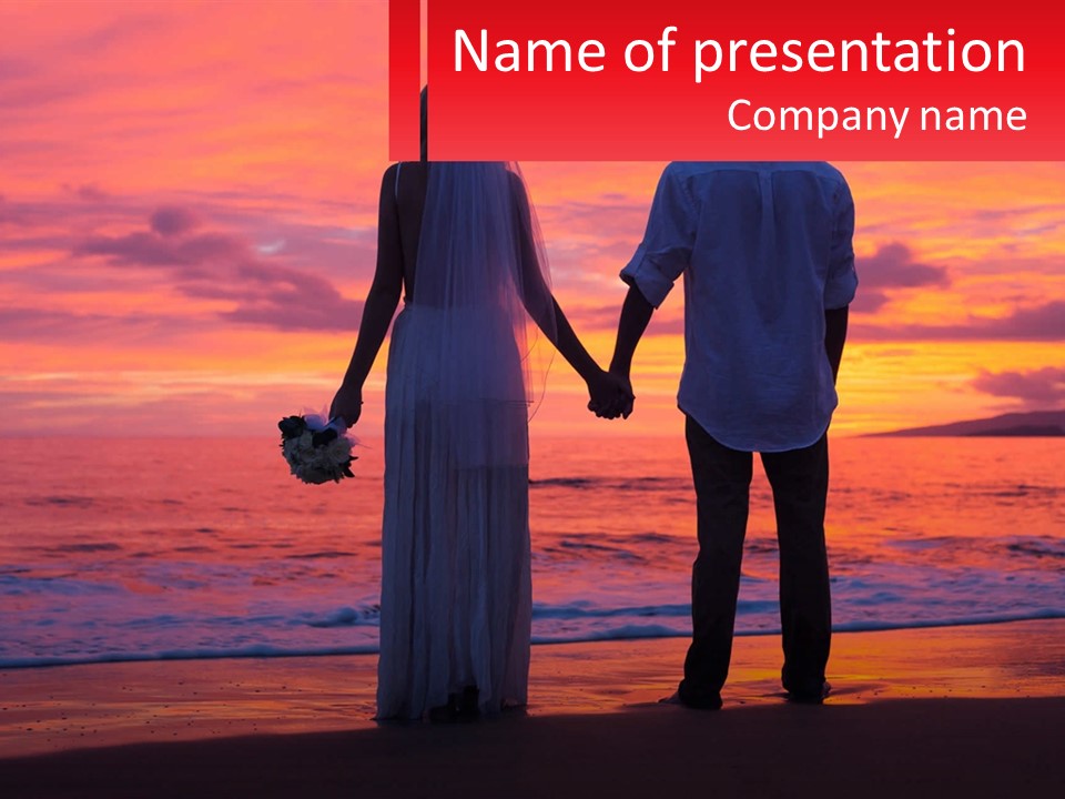 A Man And A Woman Holding Hands On A Beach At Sunset PowerPoint Template